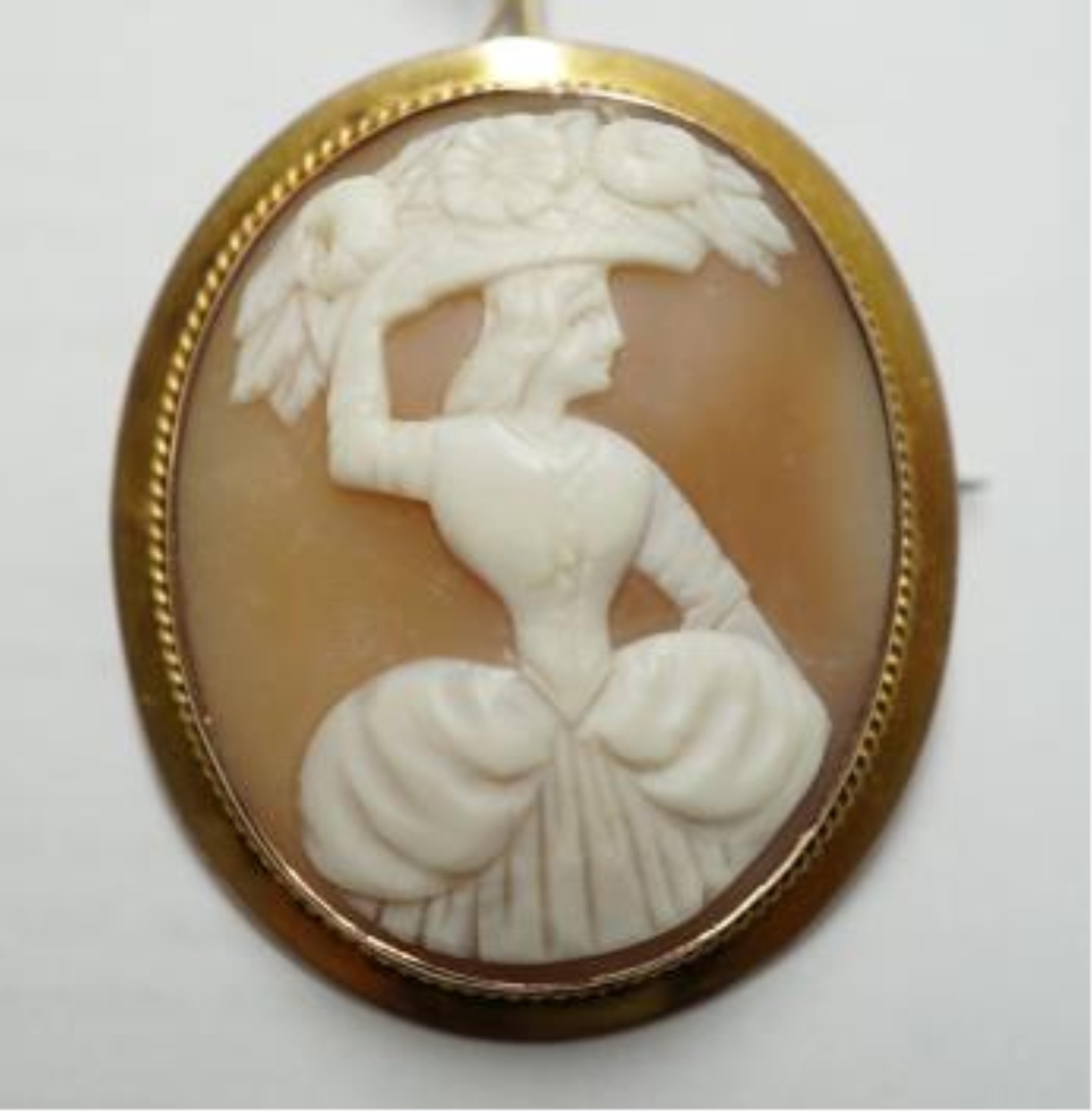 A 9ct and oval cameo shell set brooch, 40mm, gross weight 8.2 grams. Condition - fair